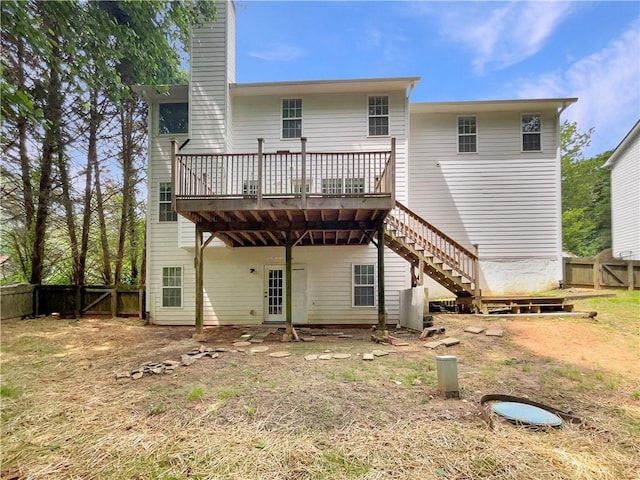 6001 Deer Springs Ln NW, Acworth, GA 30101 - back of house with a wooden deck, a fenced backyard, stairs, a chimney, and central air condition unit
