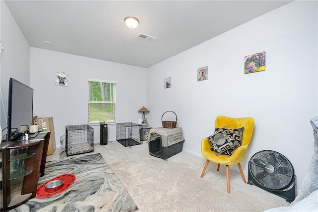 living area featuring light colored carpet