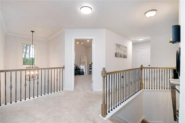 corridor featuring light colored carpet, an inviting chandelier, and ornamental molding