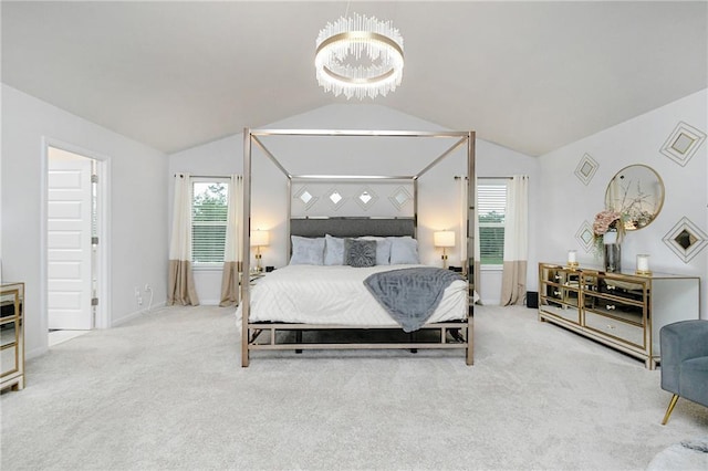 bedroom featuring carpet flooring, lofted ceiling, and a notable chandelier