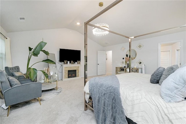 carpeted bedroom with lofted ceiling