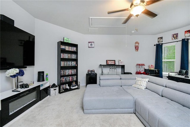 living room featuring ceiling fan and light colored carpet