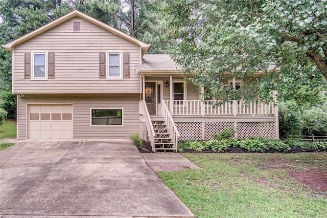 7060 Steel Wood Dr NW, Kennesaw, GA 30152 - tri-level home with a porch, a garage, driveway, and stairway