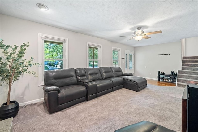 7060 Steel Wood Dr NW, Kennesaw, GA 30152 - living area with carpet flooring, stairway, a ceiling fan, baseboards, and a textured ceiling