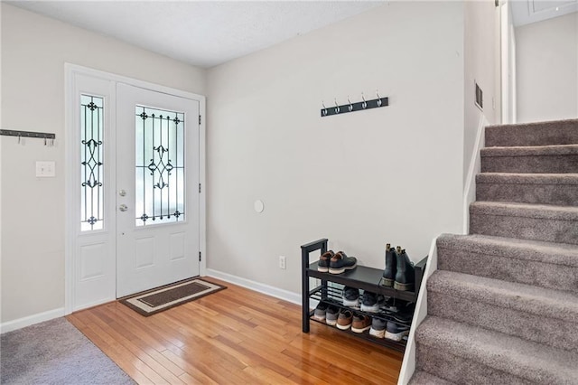 7060 Steel Wood Dr NW, Kennesaw, GA 30152 - entrance foyer featuring stairs, baseboards, and wood-type flooring