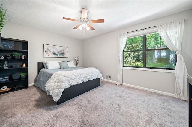 7060 Steel Wood Dr NW, Kennesaw, GA 30152 - carpeted bedroom with a textured ceiling, baseboards, and ceiling fan
