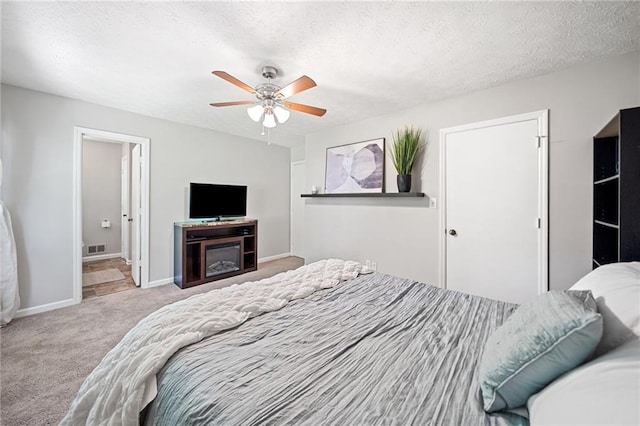 7060 Steel Wood Dr NW, Kennesaw, GA 30152 - carpeted bedroom with baseboards, a textured ceiling, a ceiling fan, and ensuite bathroom