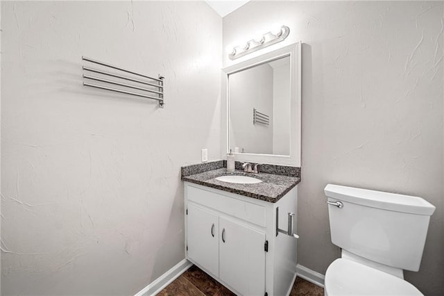 7060 Steel Wood Dr NW, Kennesaw, GA 30152 - half bath with vanity, toilet, and baseboards