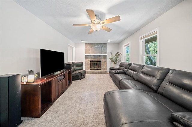 7060 Steel Wood Dr NW, Kennesaw, GA 30152 - living room featuring light colored carpet, a ceiling fan, and a fireplace