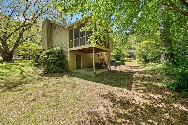 7060 Steel Wood Dr NW, Kennesaw, GA 30152 - back of property featuring a patio, a sunroom, and a yard