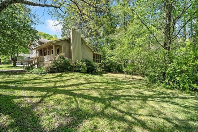 7060 Steel Wood Dr NW, Kennesaw, GA 30152 - view of grassy yard featuring a porch