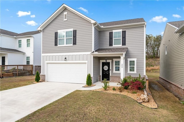 300 Hyde Park, Winder, GA 30680 - traditional-style home featuring a garage, a front lawn, brick siding, board and batten siding, and driveway