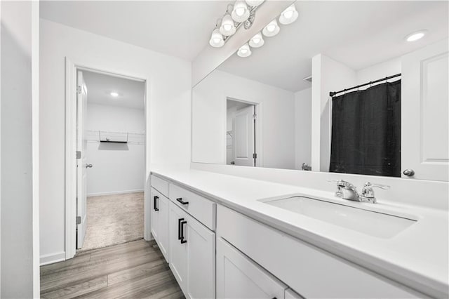 300 Hyde Park, Winder, GA 30680 - bedroom with baseboards, a ceiling fan, and light carpet