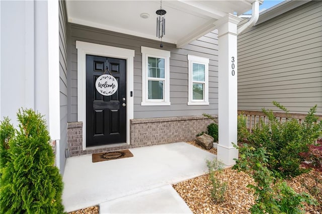 300 Hyde Park, Winder, GA 30680 - half bath featuring baseboards, toilet, wood finished floors, and visible vents