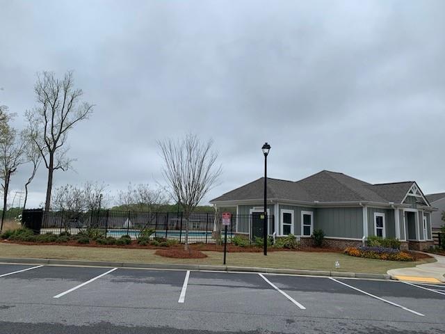 300 Hyde Park, Winder, GA 30680 - view of front of property with fence, uncovered parking, and roof with shingles
