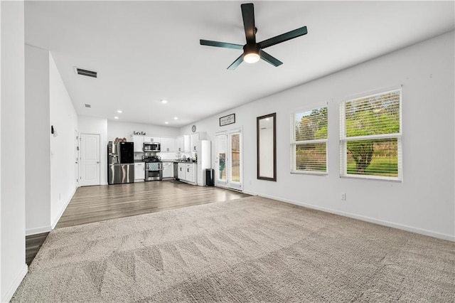 300 Hyde Park, Winder, GA 30680 - bathroom featuring baseboards, wood finished floors, and toilet