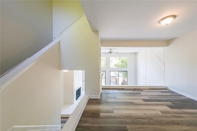 interior space featuring hardwood / wood-style floors and ceiling fan