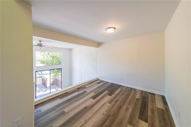 spare room with dark hardwood / wood-style flooring