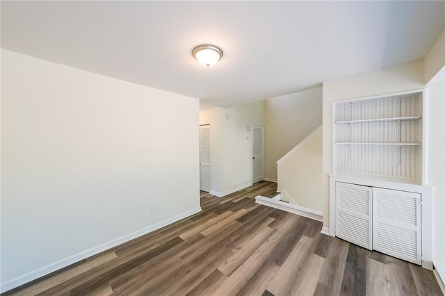 empty room featuring dark wood-type flooring