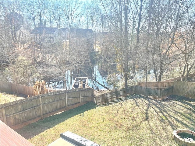 view of yard with a fenced backyard