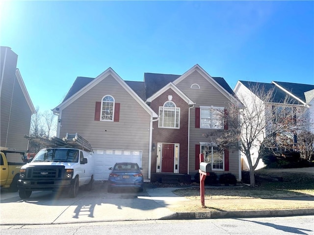 traditional-style home with driveway and an attached garage