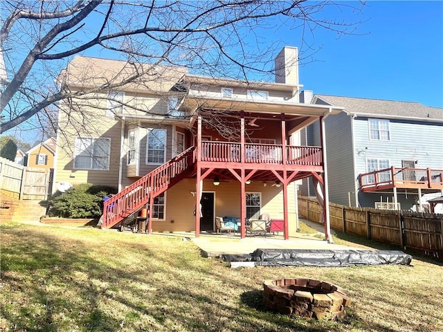 back of house featuring fence private yard, a patio area, stairs, and a wooden deck