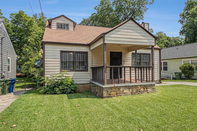 821 Erin Ave SW, Atlanta, GA 30310 - view of front of house featuring a front lawn, covered porch, a chimney, and a shingled roof