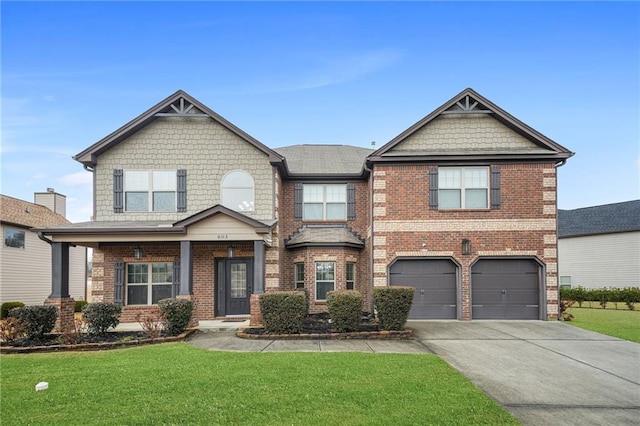 craftsman-style home featuring a garage and a front lawn