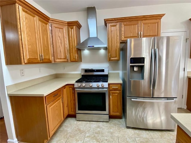 kitchen featuring appliances with stainless steel finishes, light tile patterned floors, and wall chimney exhaust hood