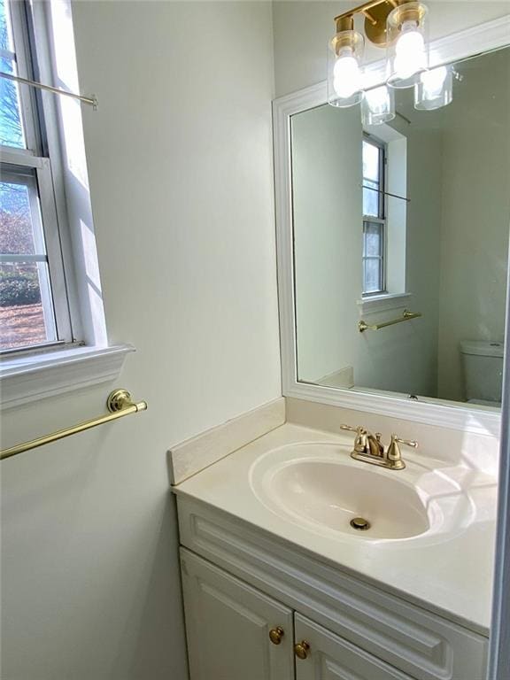 bathroom with vanity and toilet