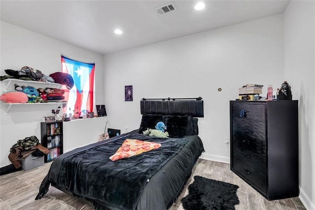 bedroom featuring light hardwood / wood-style flooring