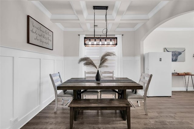 dining area with beam ceiling, hardwood / wood-style floors, and coffered ceiling