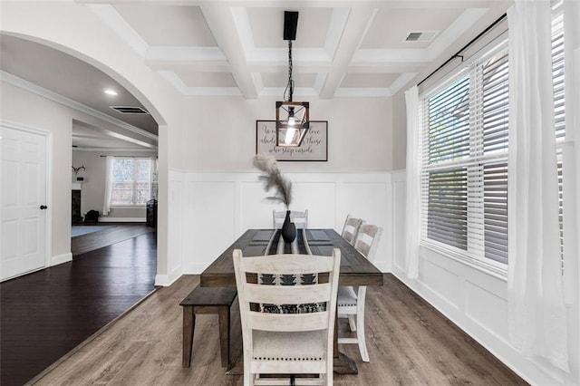 dining room featuring plenty of natural light, dark hardwood / wood-style flooring, and coffered ceiling