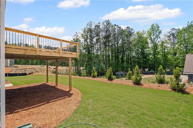 view of yard featuring a wooden deck