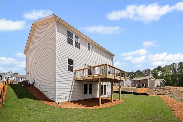 back of property featuring central AC unit, a yard, and a deck