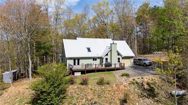 306 Pig Trl, Cherry Log, GA 30522 - back of property with a wooden deck, a chimney, and metal roof