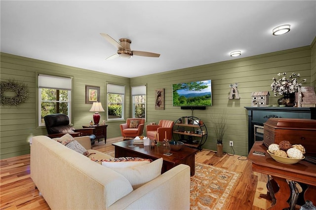 306 Pig Trl, Cherry Log, GA 30522 - living room featuring a ceiling fan, wood walls, and wood finished floors