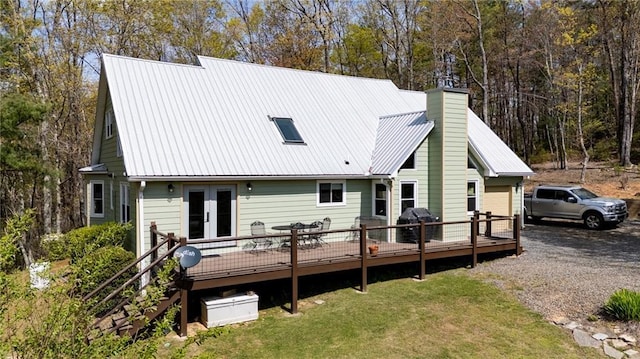 306 Pig Trl, Cherry Log, GA 30522 - rear view of property featuring a wooden deck, a chimney, french doors, a yard, and metal roof