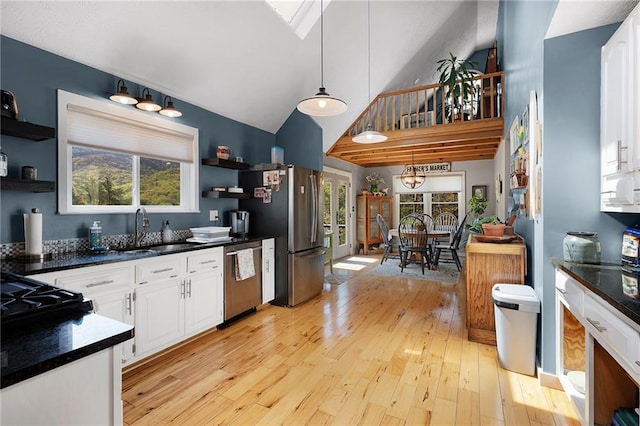 306 Pig Trl, Cherry Log, GA 30522 - kitchen with open shelves, dark countertops, white cabinets, a sink, and stainless steel appliances
