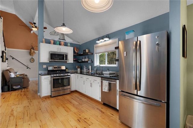 306 Pig Trl, Cherry Log, GA 30522 - kitchen with dark countertops, white cabinets, a ceiling fan, appliances with stainless steel finishes, and vaulted ceiling