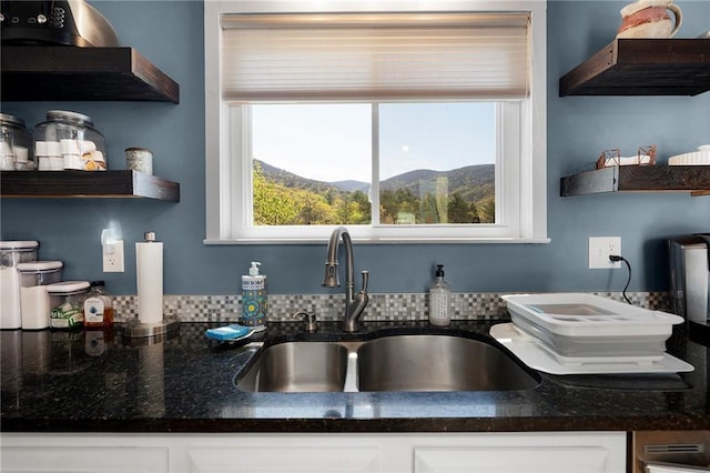 306 Pig Trl, Cherry Log, GA 30522 - kitchen featuring open shelves, a sink, white cabinets, a mountain view, and dark stone countertops