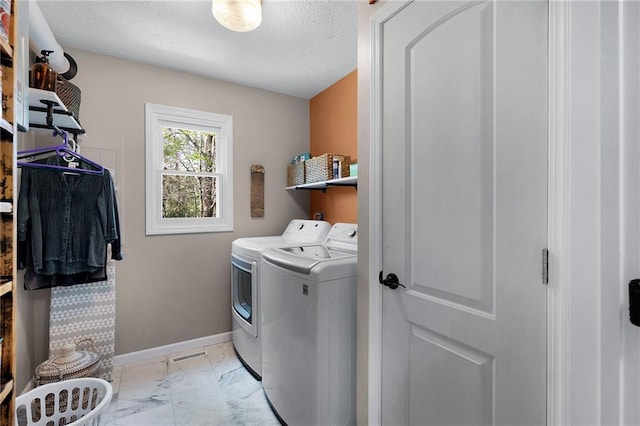 306 Pig Trl, Cherry Log, GA 30522 - laundry room featuring laundry area, a textured ceiling, marble finish floor, baseboards, and washing machine and dryer