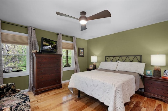 306 Pig Trl, Cherry Log, GA 30522 - bedroom featuring light wood-style floors, baseboards, and a ceiling fan