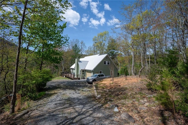 306 Pig Trl, Cherry Log, GA 30522 - view of side of home featuring dirt driveway, a chimney, and a deck