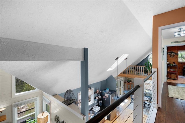 306 Pig Trl, Cherry Log, GA 30522 - interior space with a textured ceiling, hardwood / wood-style flooring, lofted ceiling, and an upstairs landing