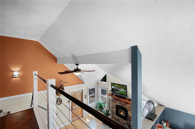 306 Pig Trl, Cherry Log, GA 30522 - interior space with wood finished floors, a textured ceiling, lofted ceiling, and an upstairs landing