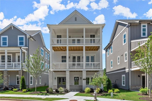 1417 Coretta Scott Bnd, Atlanta, GA 30318 - view of front facade with a balcony and french doors
