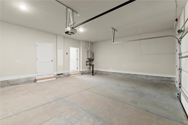 1417 Coretta Scott Bnd, Atlanta, GA 30318 - garage with a garage door opener and water heater