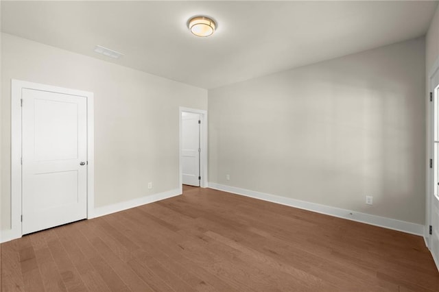1417 Coretta Scott Bnd, Atlanta, GA 30318 - unfurnished bedroom featuring wood finished floors and baseboards