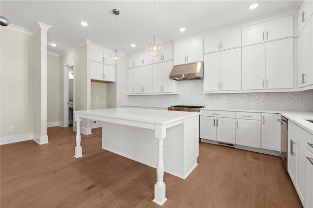 1417 Coretta Scott Bnd, Atlanta, GA 30318 - kitchen with under cabinet range hood, crown molding, dishwasher, decorative backsplash, and white cabinets